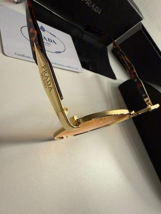 Occhiali da sole Prada oro e arancio