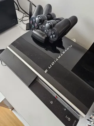 Ps3 + 2 mandos + base carga