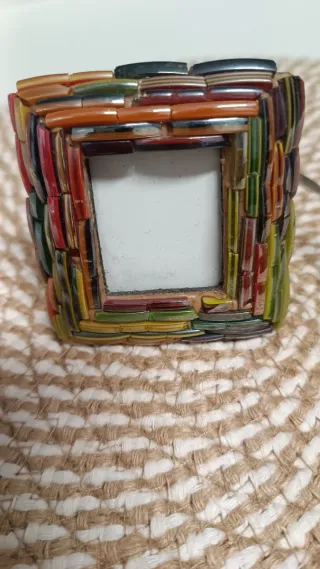 Marco de fotos y apagavelas decorado