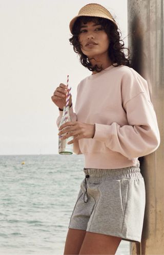 Sudadera rosa claro corta mujer