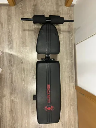 Banco de pesas + Barra y Mancuernas