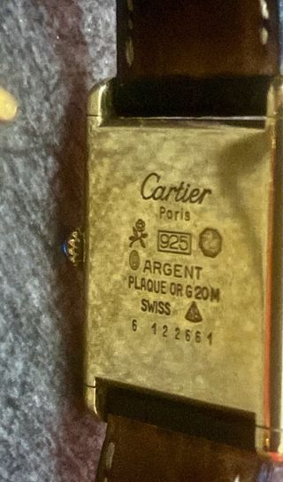 Reloj Cartier Tank Must Negro y Dorado