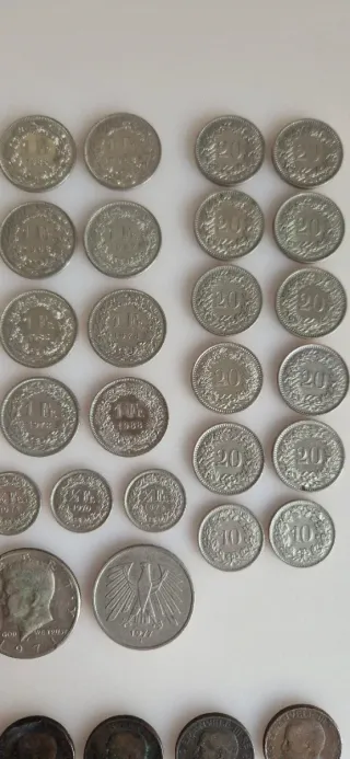 Lote monedas francos suizos y otras