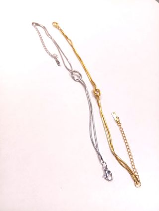 Coppia braccialetti nodo oro e argento