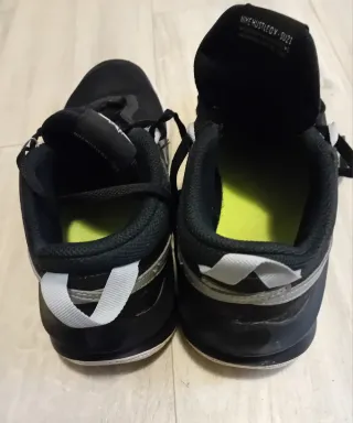 Scarpe Nike Hustle nere e argento