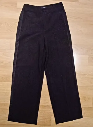 Pantalón smockint negro KIABI mujer.