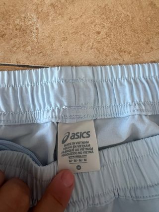 Pantalón de chándal Asics azul y blanco