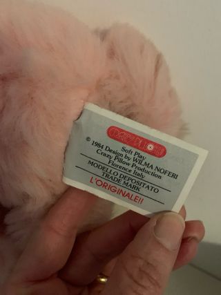 Peluche rosa con bavaglino