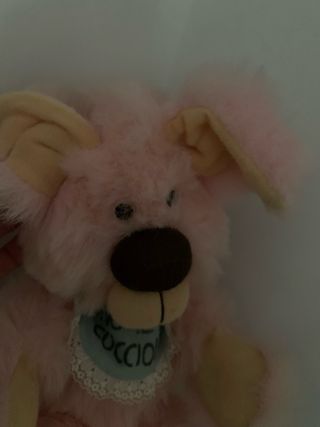 Peluche rosa con bavaglino