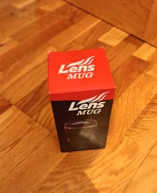 Taza con forma de objetivo de cámara