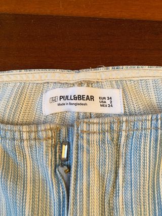 Pantalón vaquero con rayas azules y blancas. 34/XS