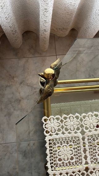 Mesa de centro de cristal y metal dorado