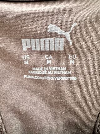 Sujetador deportivo Puma negro y naranja