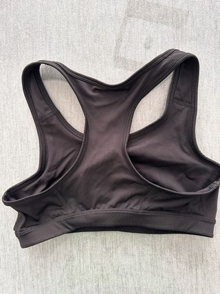 Sujetador deportivo Puma negro y naranja