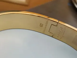 Pulsera Hermes Negra y Dorada