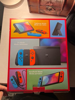 Nintendo Switch OLED casi nueva funda+protector