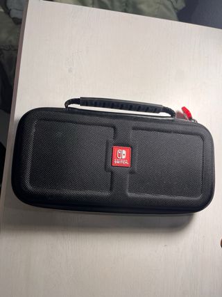 Nintendo Switch OLED casi nueva funda+protector