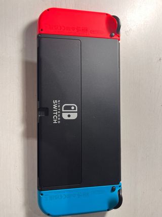 Nintendo Switch OLED casi nueva funda+protector