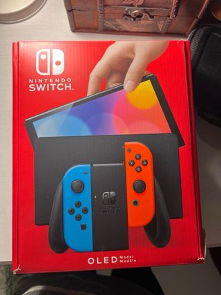 Nintendo Switch OLED casi nueva funda+protector