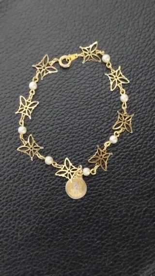 Lote religioso vintage: pulsera y broches