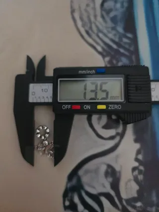 NUEVO.DE PLATA.Charm Cupido con corazón