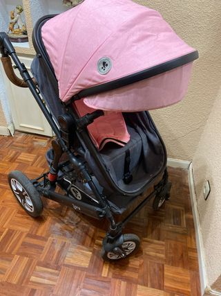 Coche de bebé rosa y gris