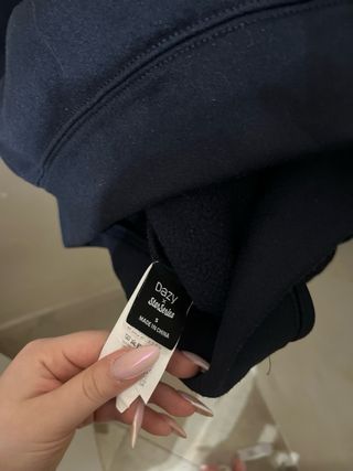 Felpa blu con fiocco bianco