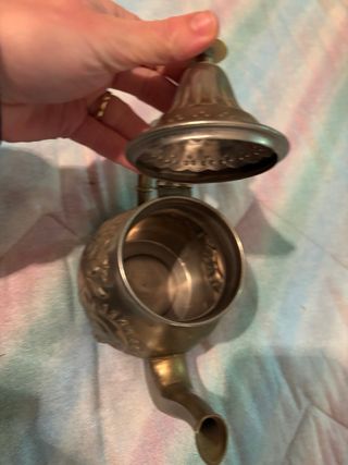 Tetera de metal decorada