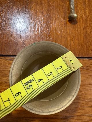 Mortero y mano di bronzo in miniatura