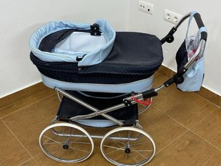 Cochecito de juguete para muñecas