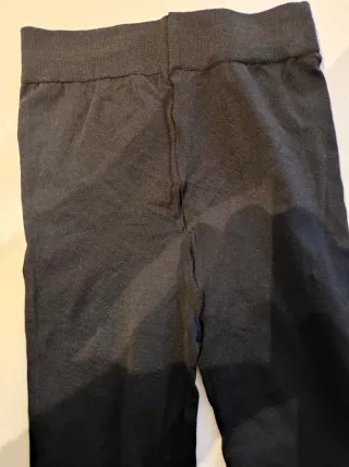 Pantaloni collant neri con zip alle caviglie