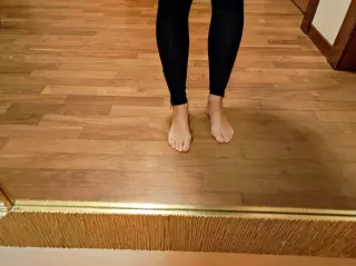 Pantaloni collant neri con zip alle caviglie