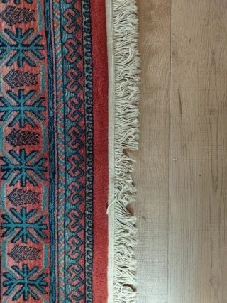 Alfombra de lana naranja y turquesa