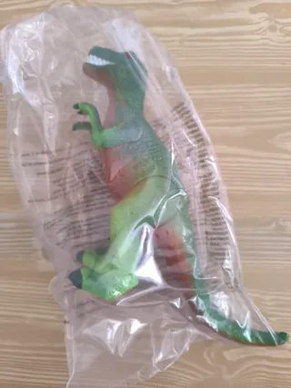 Dinosaurio de juguete precintado