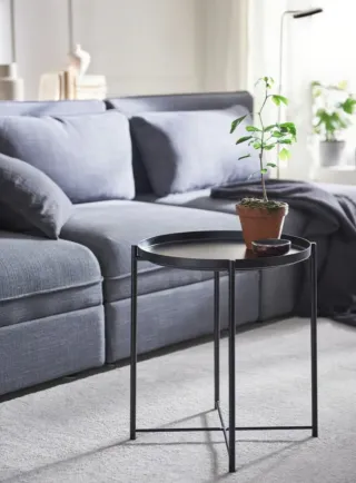 Mesa auxiliar redonda de metal negra