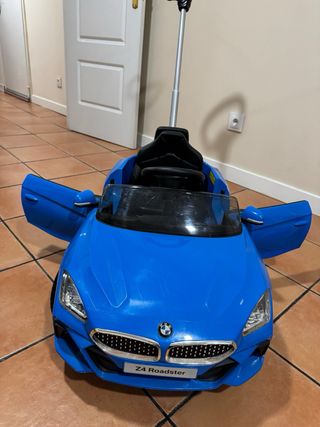 Coche niño azul con manillar
