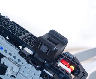 Supporto da parete per orniottero Lego