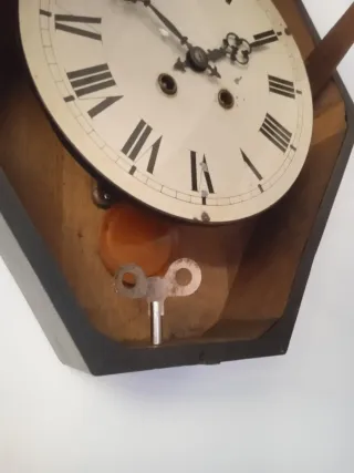 Reloj antiguo ojo de buey dorado pan de oro