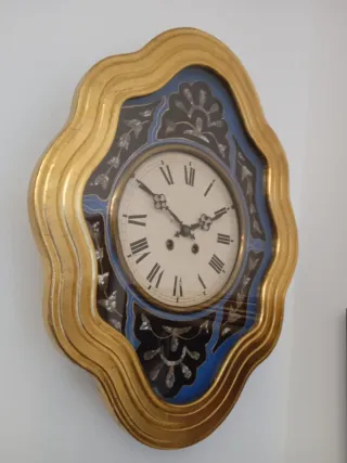 Reloj antiguo ojo de buey dorado pan de oro