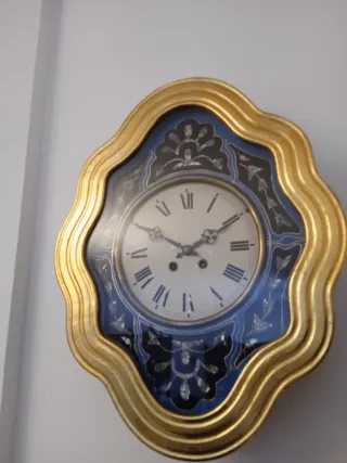 Reloj antiguo ojo de buey dorado pan de oro
