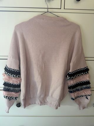 Jersey rosa con mangas decoradas