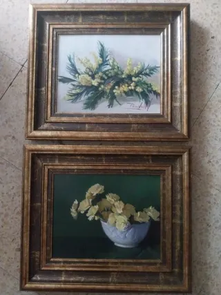 Due quadri ad olio su tela con cornici dorate