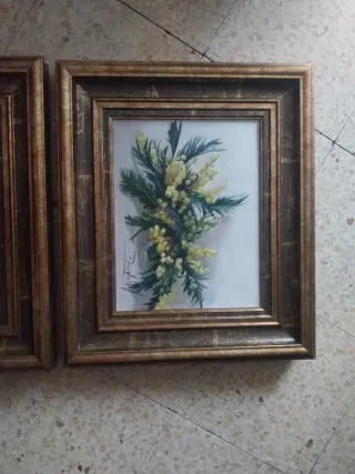 Due quadri ad olio su tela con cornici dorate