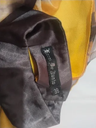 Vestido fiesta volantes y plumas