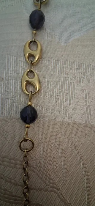 Pulsera Viceroy eslabones dorados   y lila.