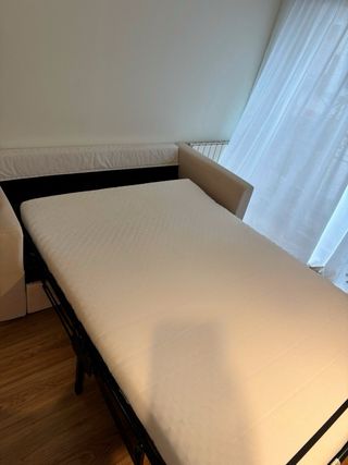 Sofá cama beige de tela