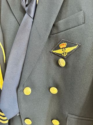 Traje comunión niño azul con detalles dorados