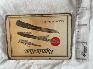 Cartello vintage in metallo della Remington