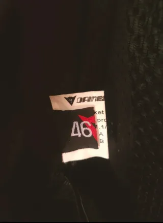 Mono Dainese cuero blanco y negro