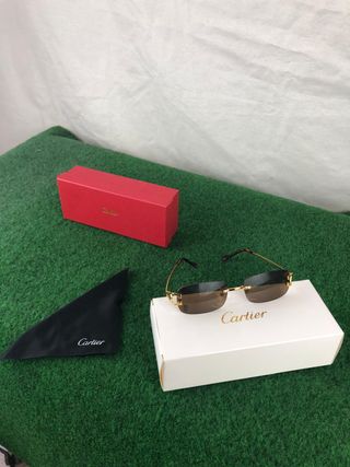Gafas de sol Cartier doradas y marrones